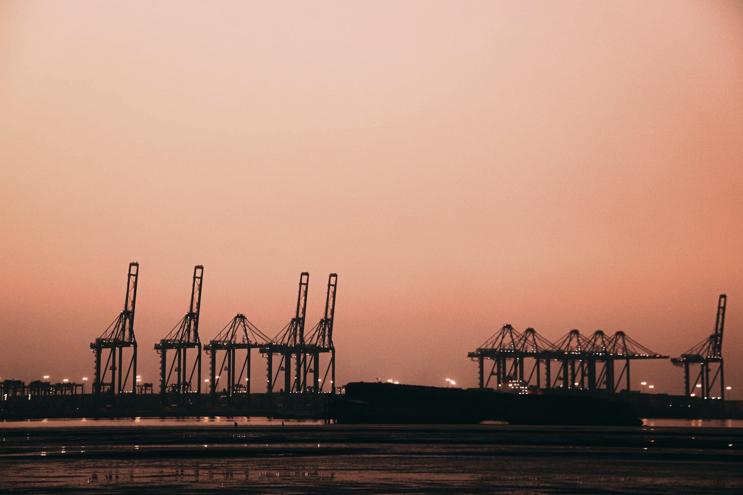 Container cranes at Karachi Port at dusk