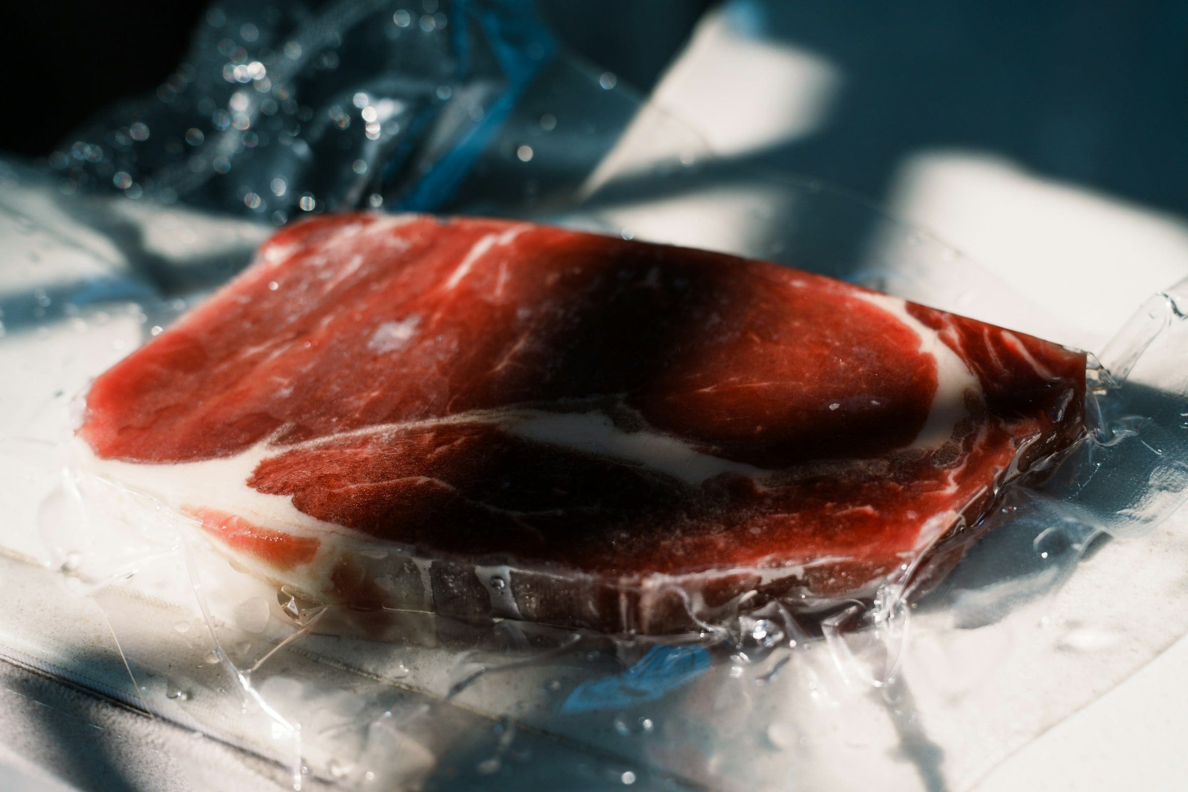 Vacuum-sealed raw beef steak